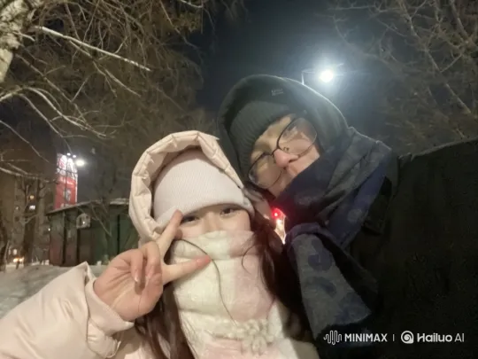 Young Couple and Child Embrace in Park at Night – AI Generated Video | Hailuo AI