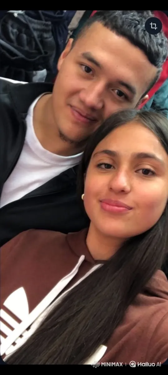 Young Family Embraces in Casual Clothing Market Stall – AI Generated Video | Hailuo AI
