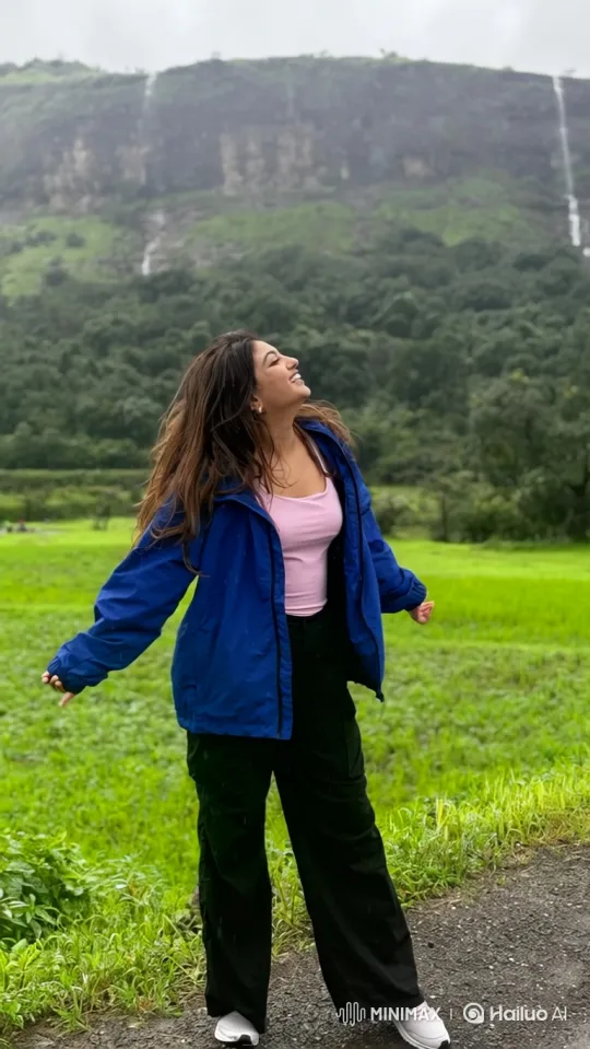 Joyful Young Woman Embraces Rain in Lush Valley – AI Generated Video | Hailuo AI