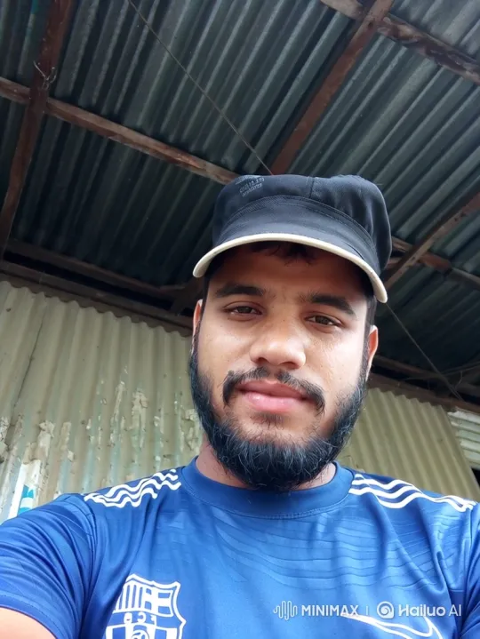 Young Man with Gentle Smile in Outdoor Setting – AI Generated Video | Hailuo AI