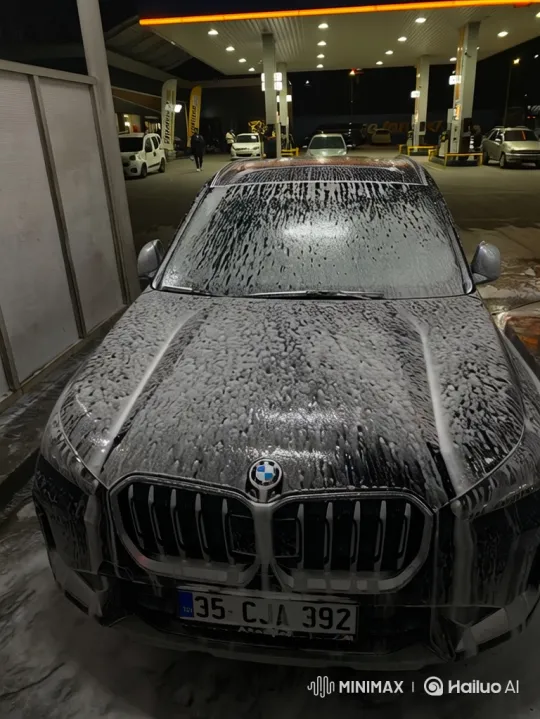 Black BMW SUV Drifts in Wet Gas Station Lot – AI Generated Video | Hailuo AI