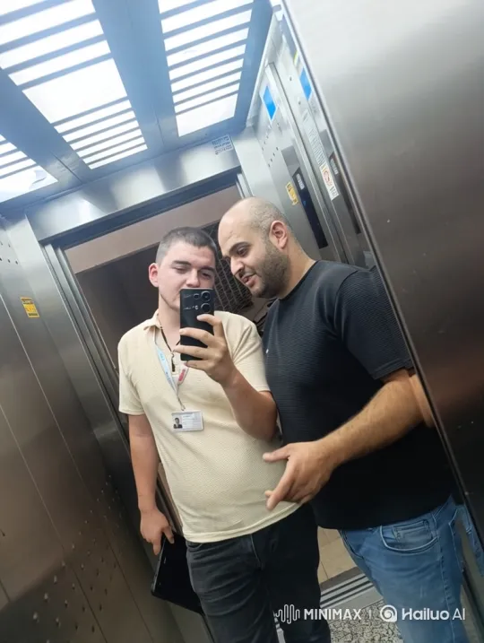 Two Men Dancing and Taking a Selfie in an Elevator – AI Generated Video | Hailuo AI