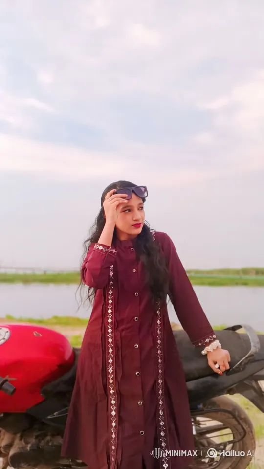Young Woman by Motorcycle: A Pensive Moment – AI Generated Video | Hailuo AI