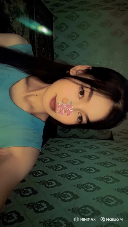 Young Woman's Serene Smile in Dim Green Light – AI Generated Video | Hailuo AI