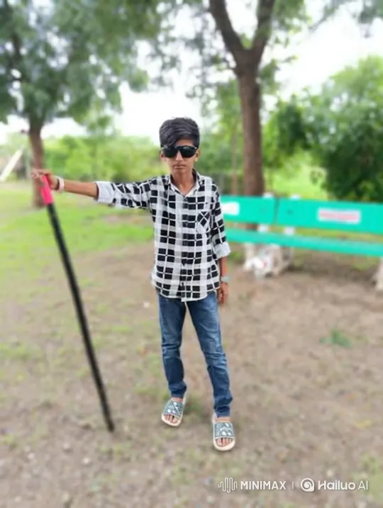 Boy Stands with Stick in Blurry Park Scene – AI Generated Video | Hailuo AI