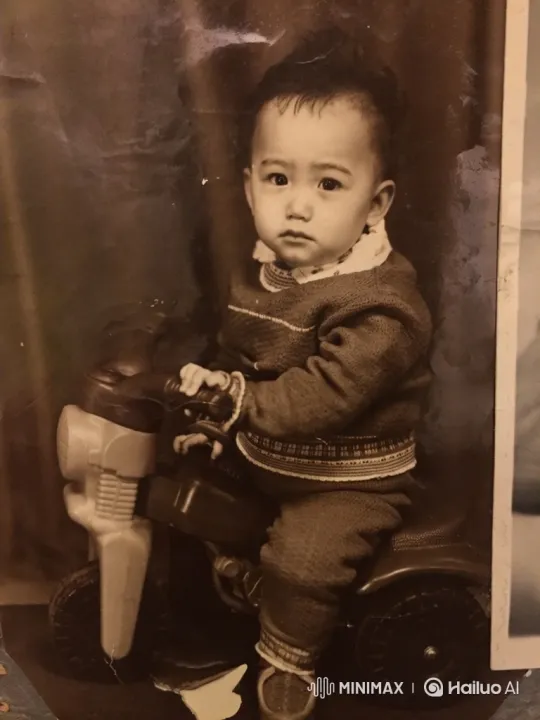 Vintage Sepia Portrait of a Toddler on Toy Motorcycle – AI Generated Video | Hailuo AI