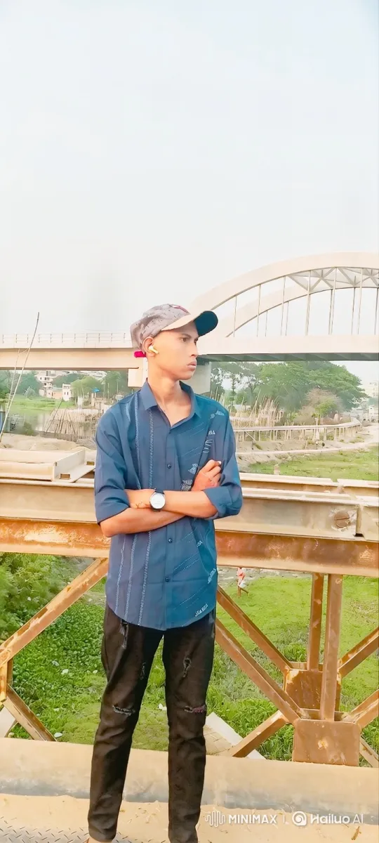 Young Man in Thoughtful Stance Amidst Rustic Landscape – AI Generated Video | Hailuo AI