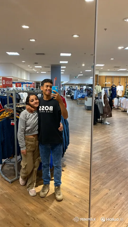 Young Couple Takes Mirror Selfie with Child in Clothing Store – AI Generated Video | Hailuo AI