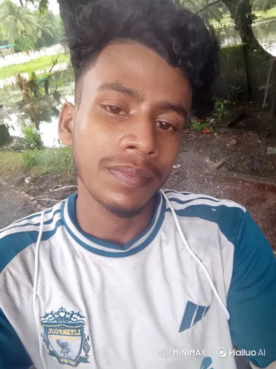 Young Man Smiles Gently in Lush Outdoor Setting – AI Generated Video | Hailuo AI