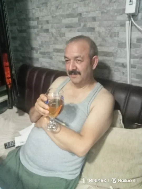 Two Middle-Aged Men Enjoying Beer on a Couch – AI Generated Video | Hailuo AI