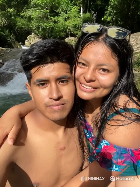 Young Family Enjoying a Joyful Moment at a Jungle Waterfall – AI Generated Video | Hailuo AI
