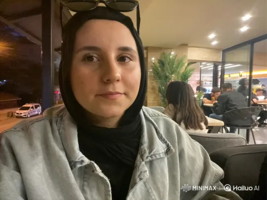 Woman and Child Share Affectionate Hug in Café – AI Generated Video | Hailuo AI