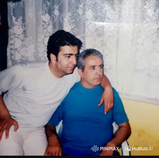 Nostalgic Embrace of Two Men in a Faded Room – AI Generated Video | Hailuo AI