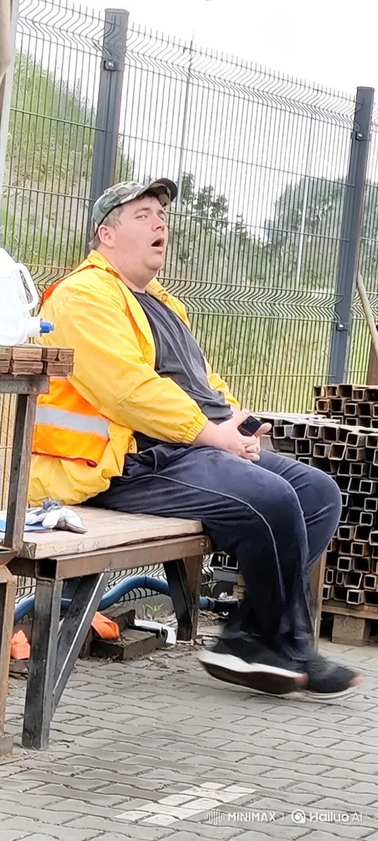 Man Nods Off on Bench in Quiet Yard – AI Generated Video | Hailuo AI