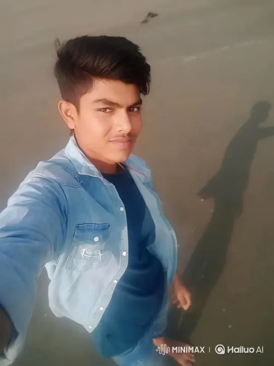 Young Man Takes Peaceful Selfie on Wet Beach – AI Generated Video | Hailuo AI