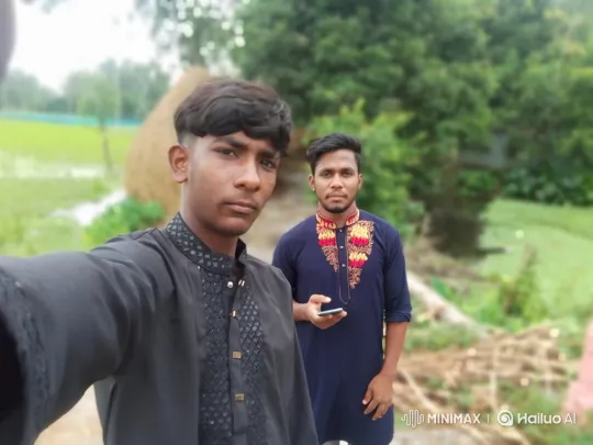 Young Men Taking Selfie in Rural Setting – AI Generated Video | Hailuo AI