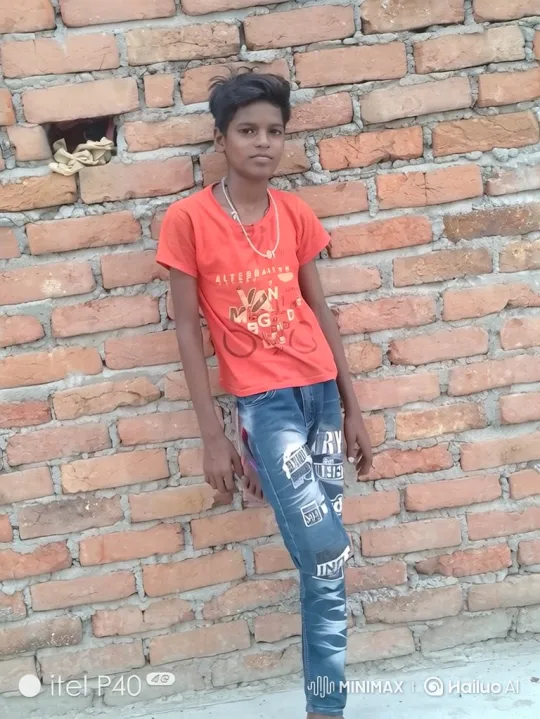 Young Boy in Relaxed Pose Against Brick Wall – AI Generated Video | Hailuo AI