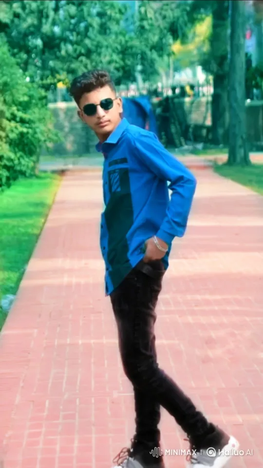 Young Man Poses in Park with Natural Flair – AI Generated Video | Hailuo AI