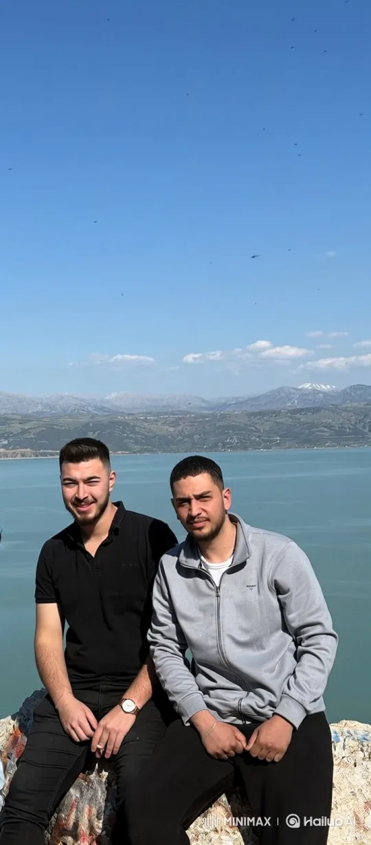 Two Men Share Intimate Kiss Against Scenic Background – AI Generated Video | Hailuo AI