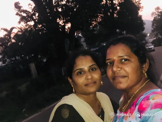 Women Greet Each Other with Warm Smiles in Twilight Setting – AI Generated Video | Hailuo AI