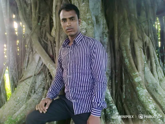 Young Man Poses by a Banyan Tree in Tranquil Scene – AI Generated Video | Hailuo AI