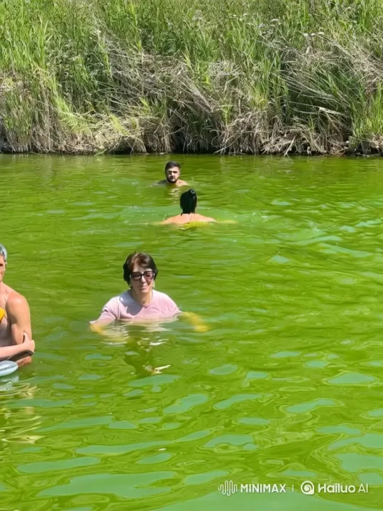 Woman Swims Leisurely in Vibrant Green Water – AI Generated Video | Hailuo AI