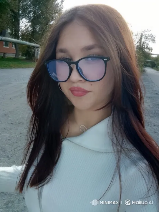 Young Woman Smiles Gently in Gravel Path Setting – AI Generated Video | Hailuo AI