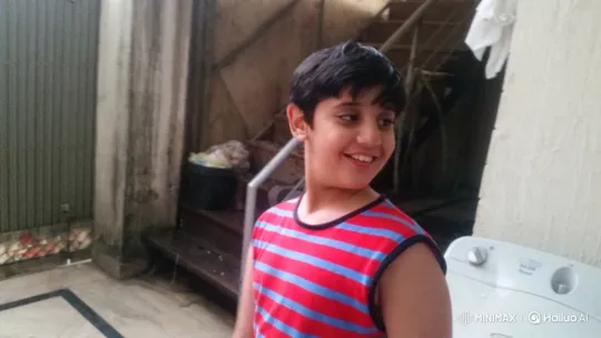 Boy Smiles Cheerfully in Indoor Setting – AI Generated Video | Hailuo AI