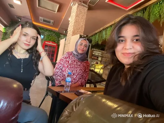 Three Women Pose for a Cozy Café Selfie – AI Generated Video | Hailuo AI