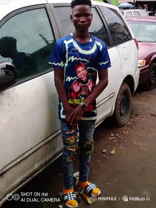 Young Man in Casual Outfit Stands Still, Camera Closes In – AI Generated Video | Hailuo AI