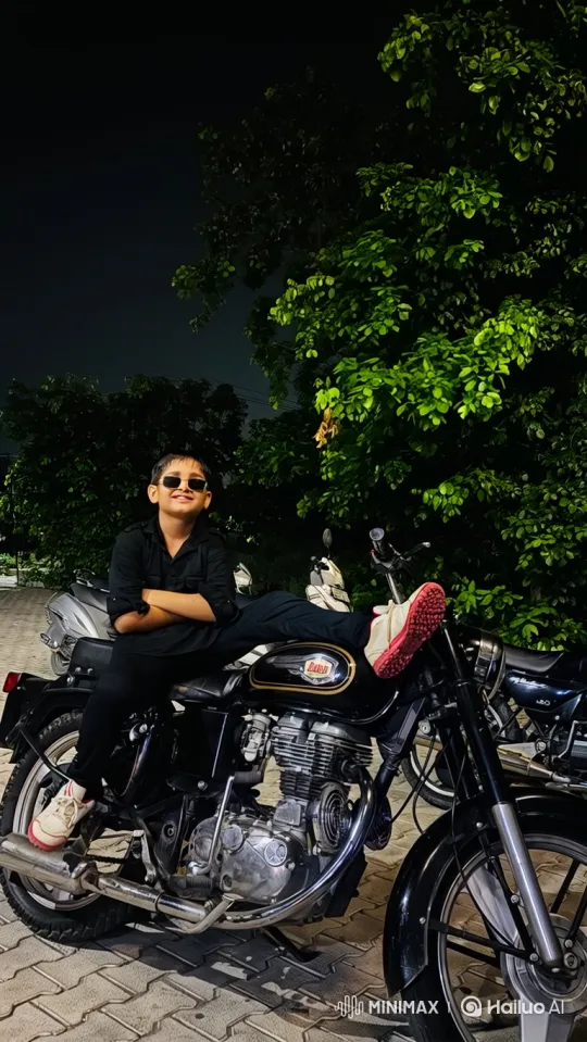 Young Boy Poses on Motorcycle at Night – AI Generated Video | Hailuo AI
