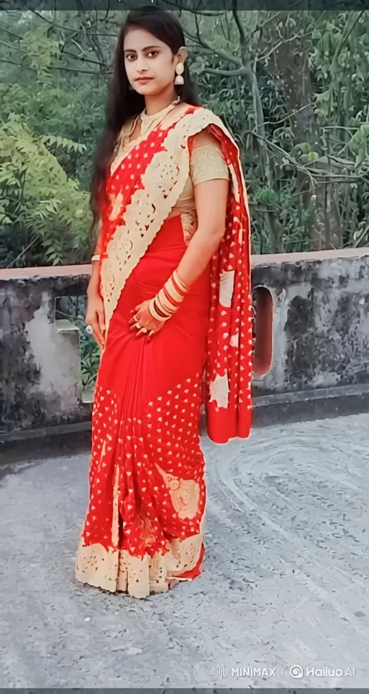 Graceful Woman in Red Sari on Rooftop - Static to Tracking Shot – AI Generated Video | Hailuo AI