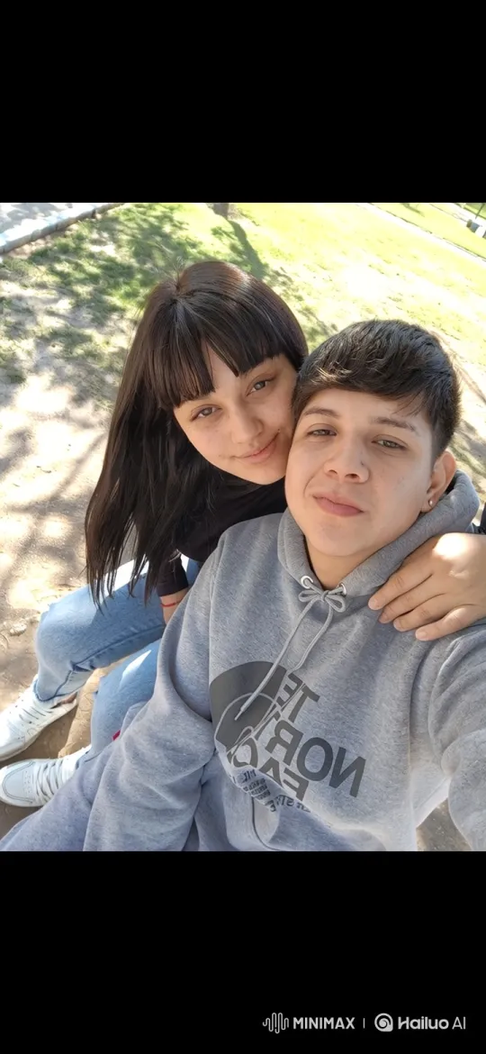 Family Reunion: Couple Embraces Running Child in Town Square – AI Generated Video | Hailuo AI