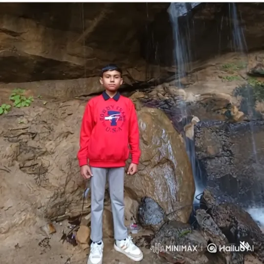 Boy Dances Energetically in Front of Waterfall – AI Generated Video | Hailuo AI