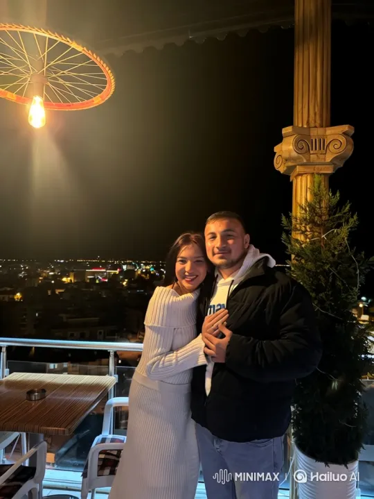 Family Embraces on Nighttime City Balcony – AI Generated Video | Hailuo AI