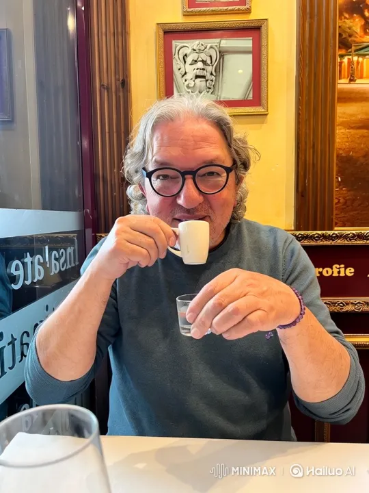 Middle-Aged Man Enjoying Espresso in Warmly Lit Cafe – AI Generated Video | Hailuo AI