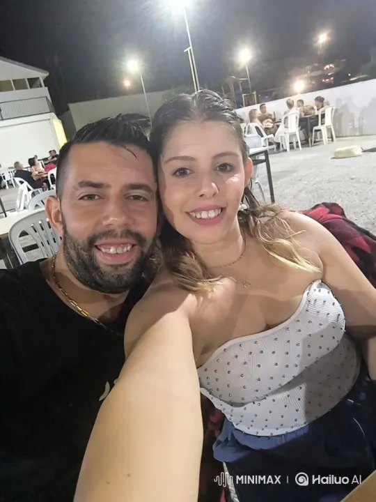 Couples' Joyful Selfie at Nighttime Patio Event – AI Generated Video | Hailuo AI