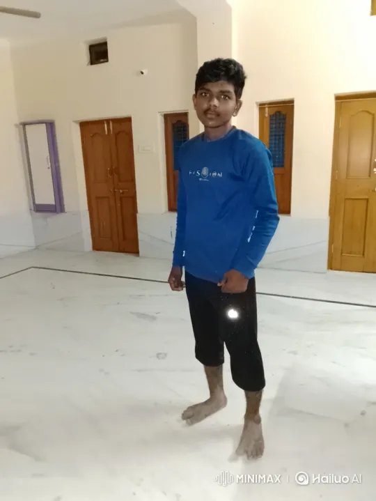 Young Man in White Room: Tracking Shot Perspective – AI Generated Video | Hailuo AI