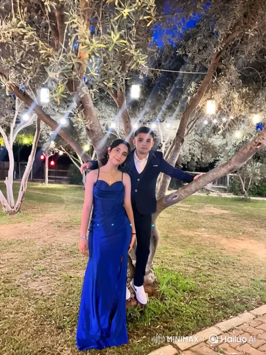 Young Couple Embraces Under Festive Lights – AI Generated Video | Hailuo AI