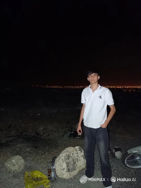 Young Man Contemplates City Lights at Night – AI Generated Video | Hailuo AI