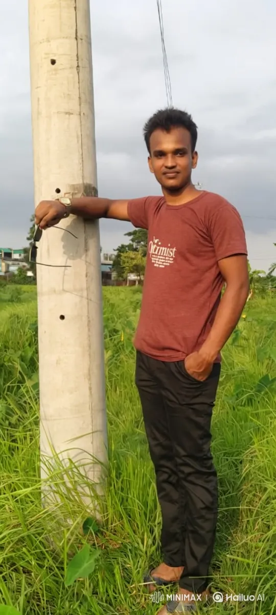 Man Smiles Gently in a Field with Utility Pole – AI Generated Video | Hailuo AI