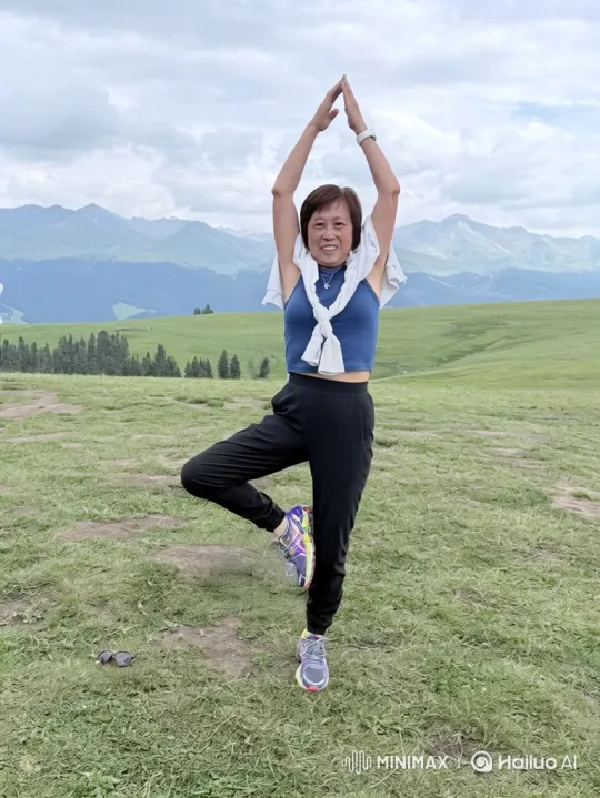 Woman Practices Flow Yoga on Hill with Mountain View – AI Generated Video | Hailuo AI