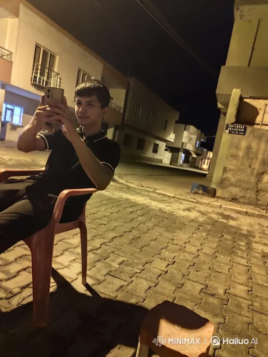 Young Man Detained by Police in Nighttime Street Scene – AI Generated Video | Hailuo AI