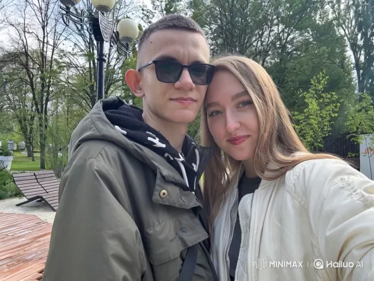 Family Embrace Captured on Phone Video in Park – AI Generated Video | Hailuo AI