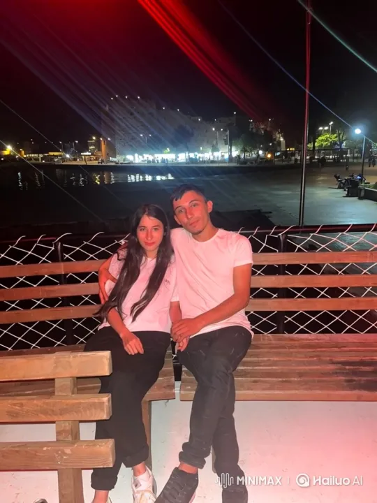 Young Couple and Child Share Intimate Hug on Bench – AI Generated Video | Hailuo AI
