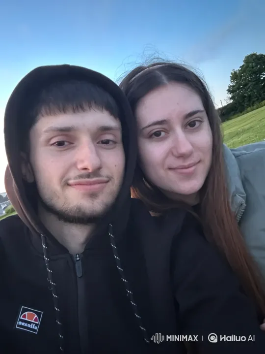 Family Embrace on a Dusk-Lit Hill – AI Generated Video | Hailuo AI