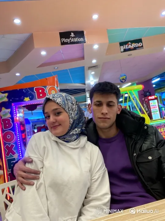 Young Couple Shares Tender Kiss in Bustling Arcade – AI Generated Video | Hailuo AI