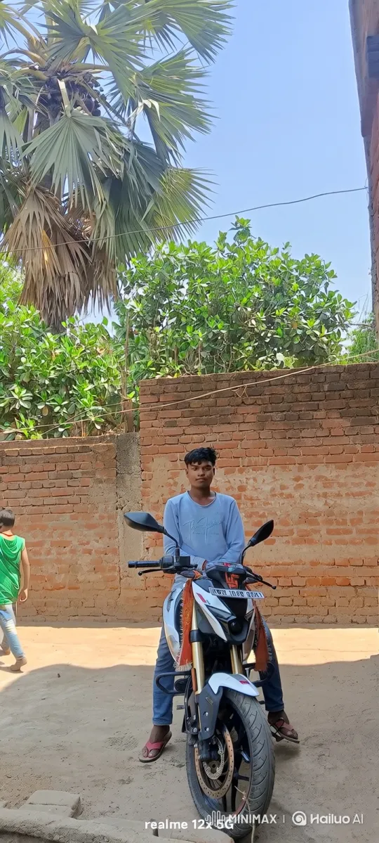 Young Man on Motorcycle in Front of Brick Wall – AI Generated Video | Hailuo AI
