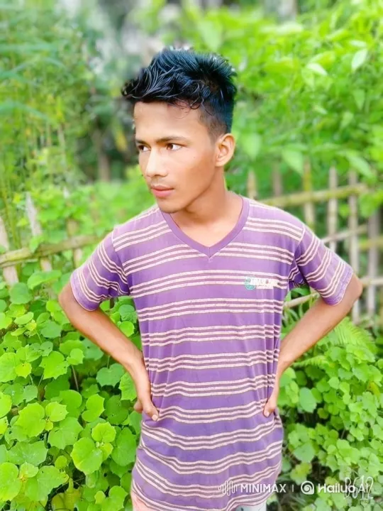 Young Man in Garden with Gentle Breeze Background – AI Generated Video | Hailuo AI