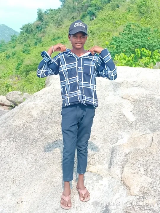 Young Man Relaxing on Rock Amidst Nature – AI Generated Video | Hailuo AI
